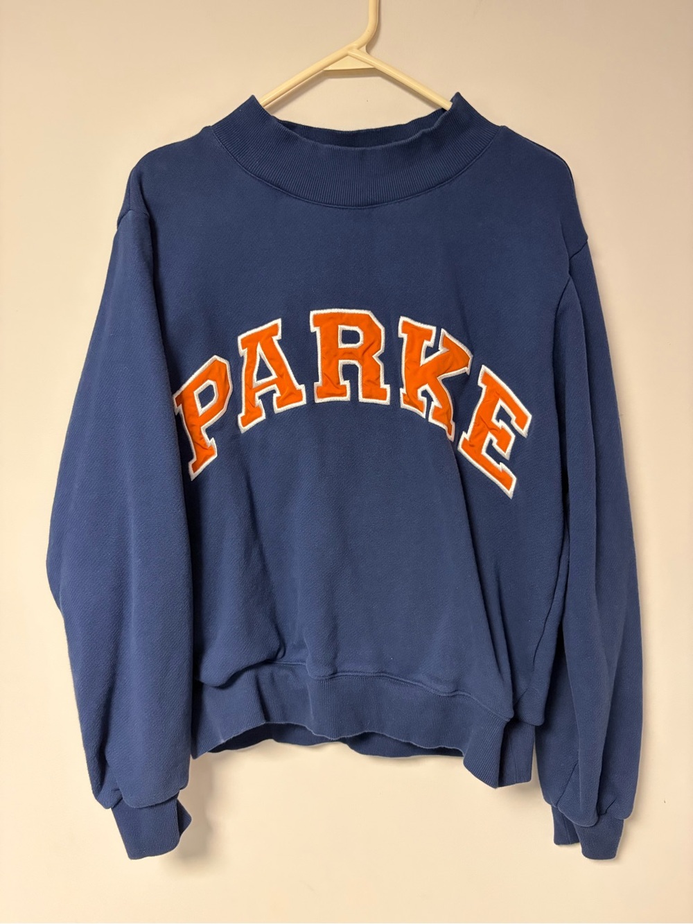Parker Blue Crewneck Sweatshirt with Orange Appliqué